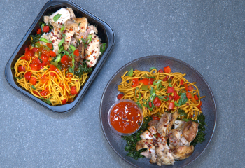 S & P Chicken Thighs, Saucy Egg Noodles, Fried Kale, Peppers, Spring Onions & Red Chilli flakes